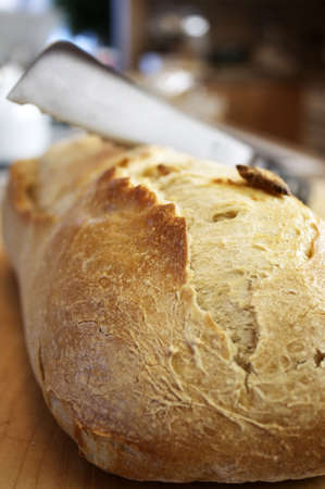 Knife cutting Bread