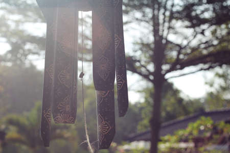 Wind chime under morning sunshineの写真素材