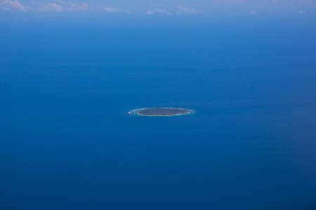 View of small island in the oceanの写真素材