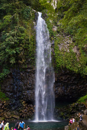 People relaxing by a waterfallのeditorial素材