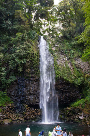 People relaxing by a waterfallのeditorial素材