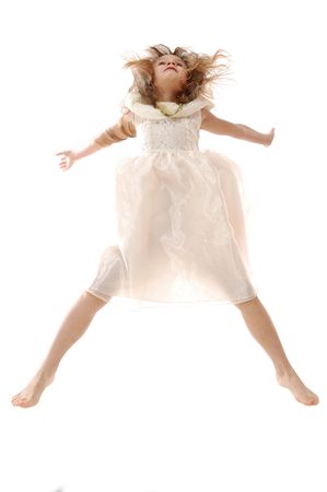 adorable caucasian 5 year old girl jumping high upの写真素材