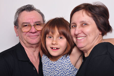 portrait of a happy grandchild with grandparents