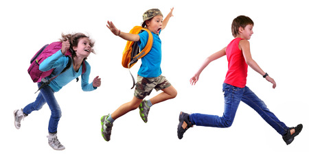 Group portrait of happy schoolgirl and schoolboys with a backpacks  running and jumping together. Isolated over white background. Education childhood conceptの写真素材