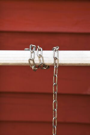A meta chain wrapped around a bar.の写真素材