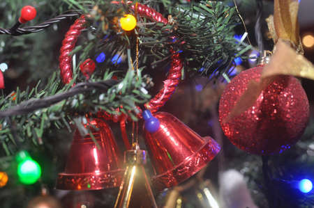 Red bell Christmas toys on the Christmas treeの写真素材