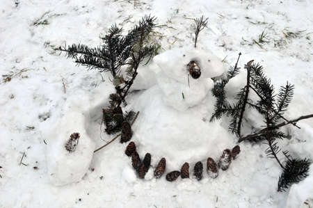 Composition Snowman with pine conesの写真素材