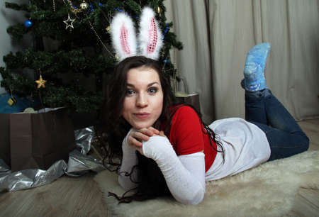 The girl in a mask hare and jeansの写真素材