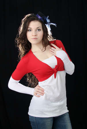 Young beautiful girl posing on a black backgroundの写真素材