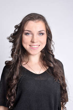 Portrait of a beautiful girl with long dark hairの写真素材