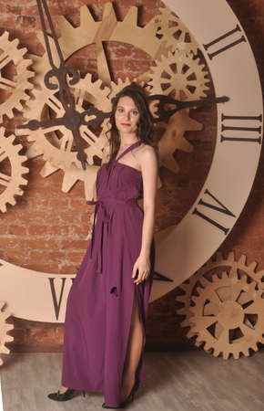 Beautiful young slim A girl in a lavender dressの写真素材