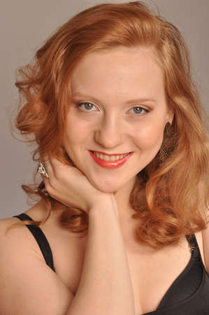 Portrait of red-haired girl with smileの写真素材