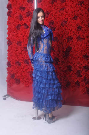 Girl in a blue dress on a pylonの写真素材