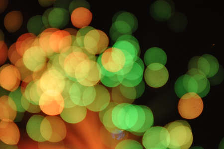 Green and yellow circles on a black backgroundの写真素材
