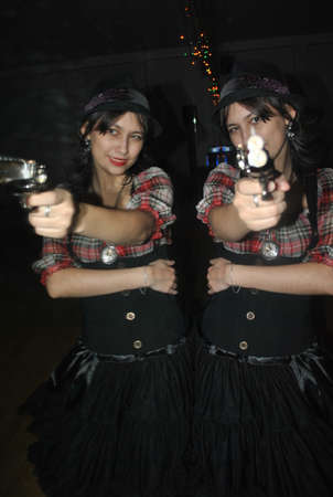 Funny girl with a pistolの写真素材
