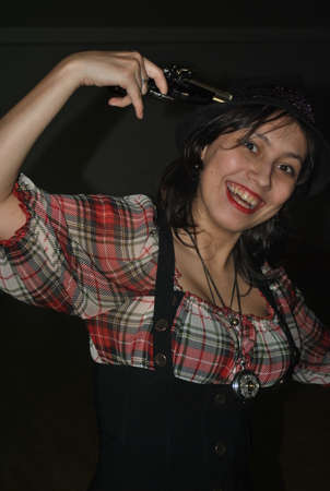 Funny girl with a pistol playingの写真素材