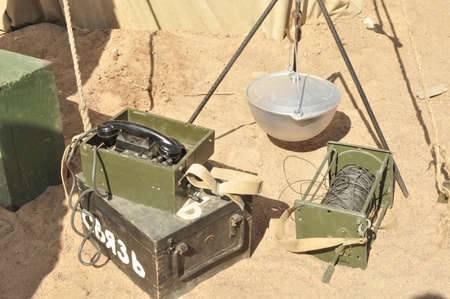 Old military items on the sand sceneryの写真素材