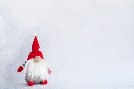 Christmas gnome in red hat holiday banner on light winter backgroundの写真素材