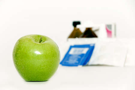 Apple and tablets isolated on a white backgroundの写真素材