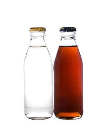 Two glass bottles filled with a liquid isolated on a white background