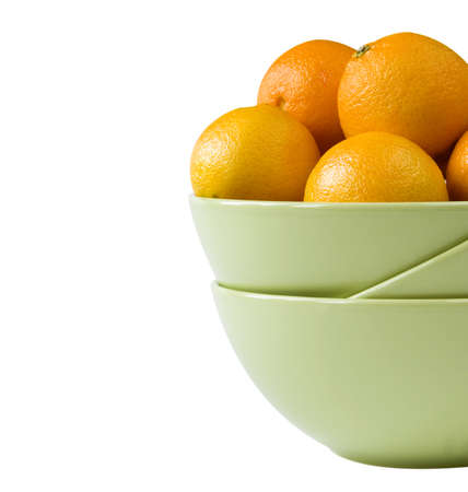 Part of a bowl with tangerines isolated on whiteの写真素材