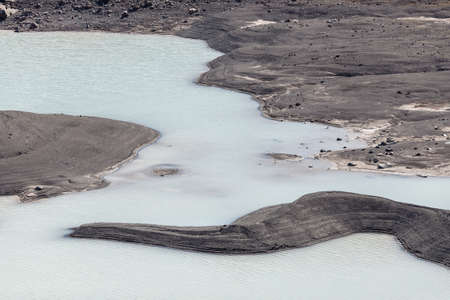 Lake of blue color among stones, Caucasus