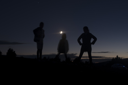 contours of three people at nightの写真素材