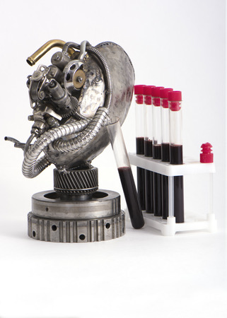heart in steampunk style is isolated on a white background with the inclined blood flaskの写真素材