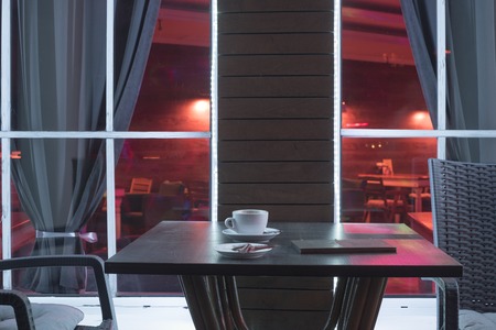 Night cafe with a table