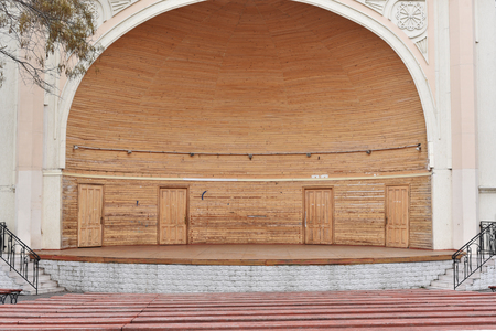 empty stage for a performance. the stage is made of wood, its old and empty. Near in the future...