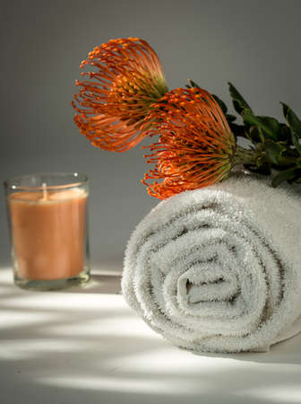 White Spa Towel ,Orange Protea flowers and Candleの写真素材
