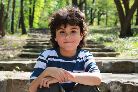 Portrait of a beautiful boy with charming smileの写真素材