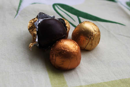 Chocolate candies on colorful cloth
