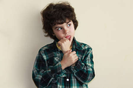 Studio portrait of a boy in colorful shirt