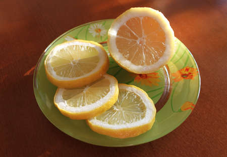 Colorful plate with fresh lemons