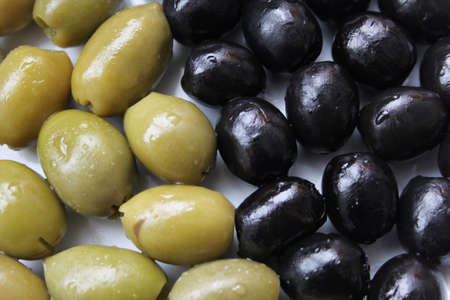 Closeup picture of green and black olives