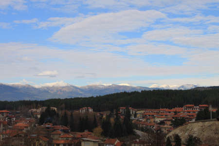 Rural panorama with little village at the foot of the mountainの写真素材