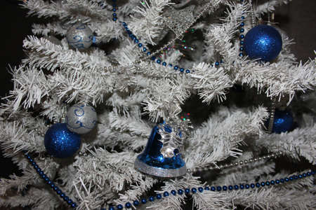 White Christmas tree with blue twinkle ballsの写真素材