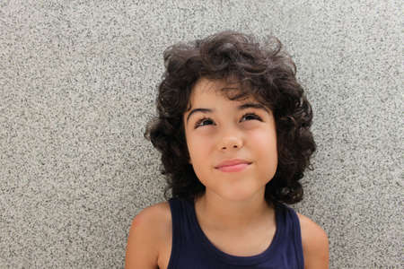 Portrait of an attractive child with curly hairの写真素材