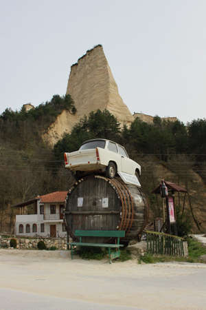 Trabant placed over a big vat like an advertisement for a local cellar in Bulgarian town of Melnikのeditorial素材