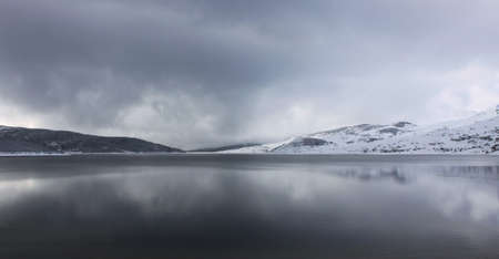The Belmeken dam, situated high in Rila mountain, Bulgaria, winter viewの写真素材
