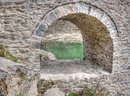 An ancient stone bridge called Devil's bridge near the town of Ardino in Bulgariaの写真素材