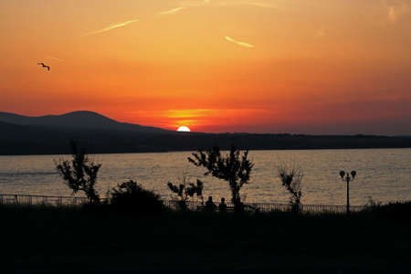A colorful sunset over the Black sea coastの写真素材