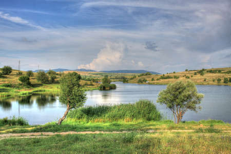 Summer landscape with a picturesque lake somewhere in Bulgarian countrysideの写真素材