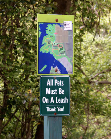 Park signage All Dogs Must Be On A Leashの写真素材