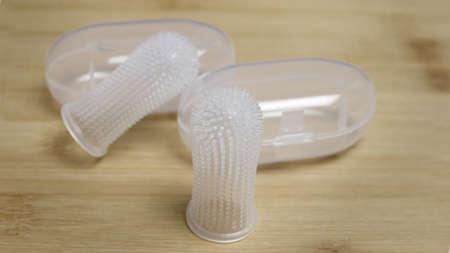 Textured Tooth Brushes For Dogs That are Placed on Your Fingerの写真素材