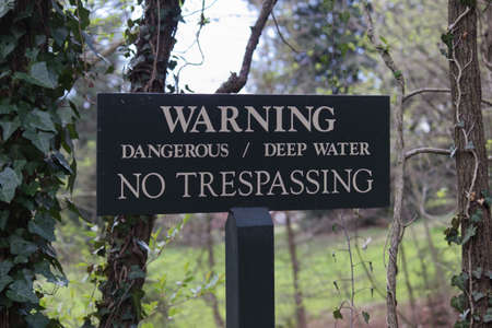 Warning Dangerous Deep Water No Trespassing Signの写真素材