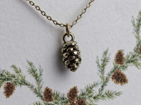 Close up shiny gold jewelry on white backgroundの写真素材