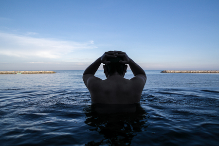 Edge of infinity swimming pool overlooking oceanの写真素材