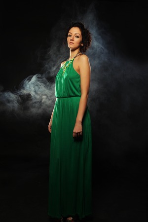 young beautiful woman in green dressの写真素材